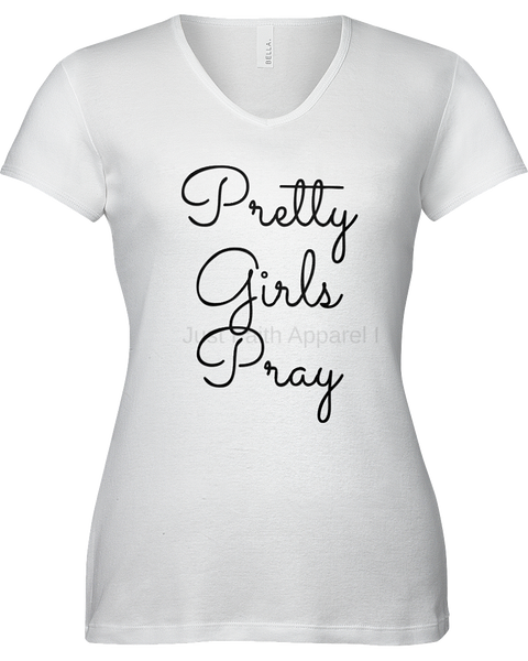 A white short-sleeve V-neck t-shirt with the phrase 'Pretty Girls Pray' printed in black cursive script across the front.